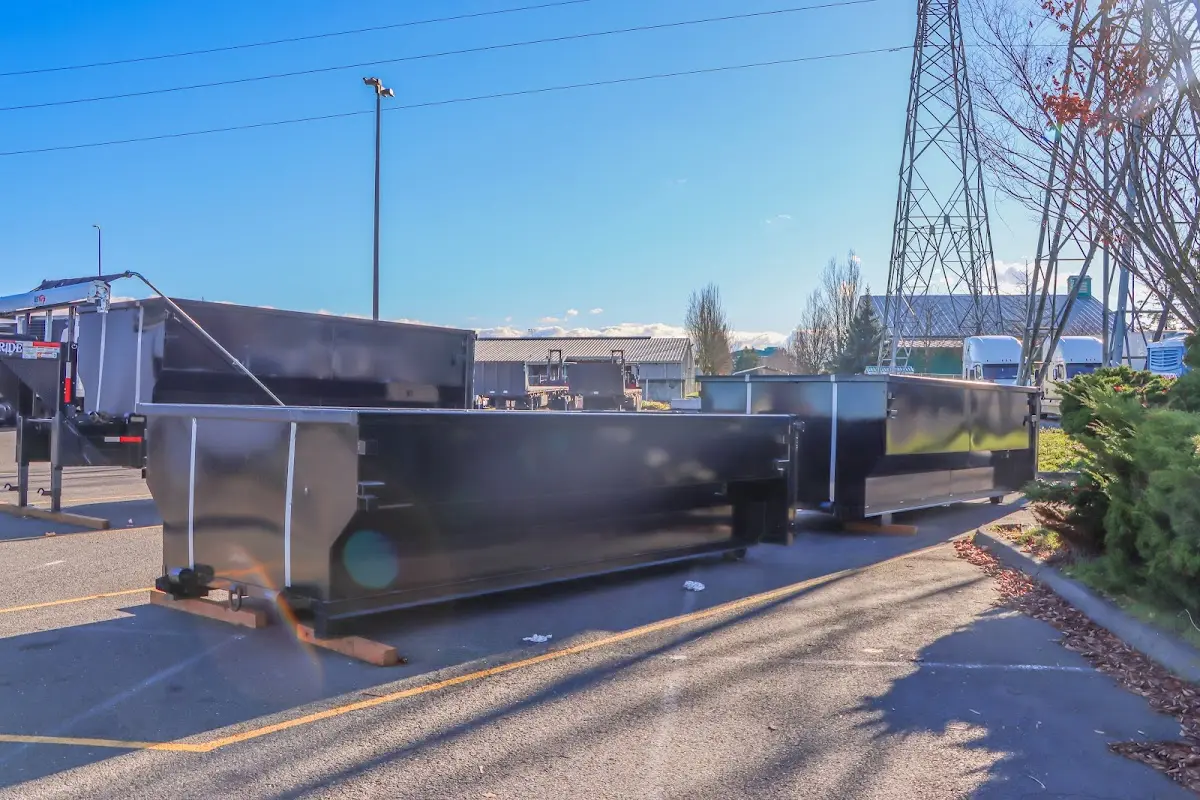 Roll-off dumpster ready for waste disposal at job site for Construction Dumpster Rental in Economy